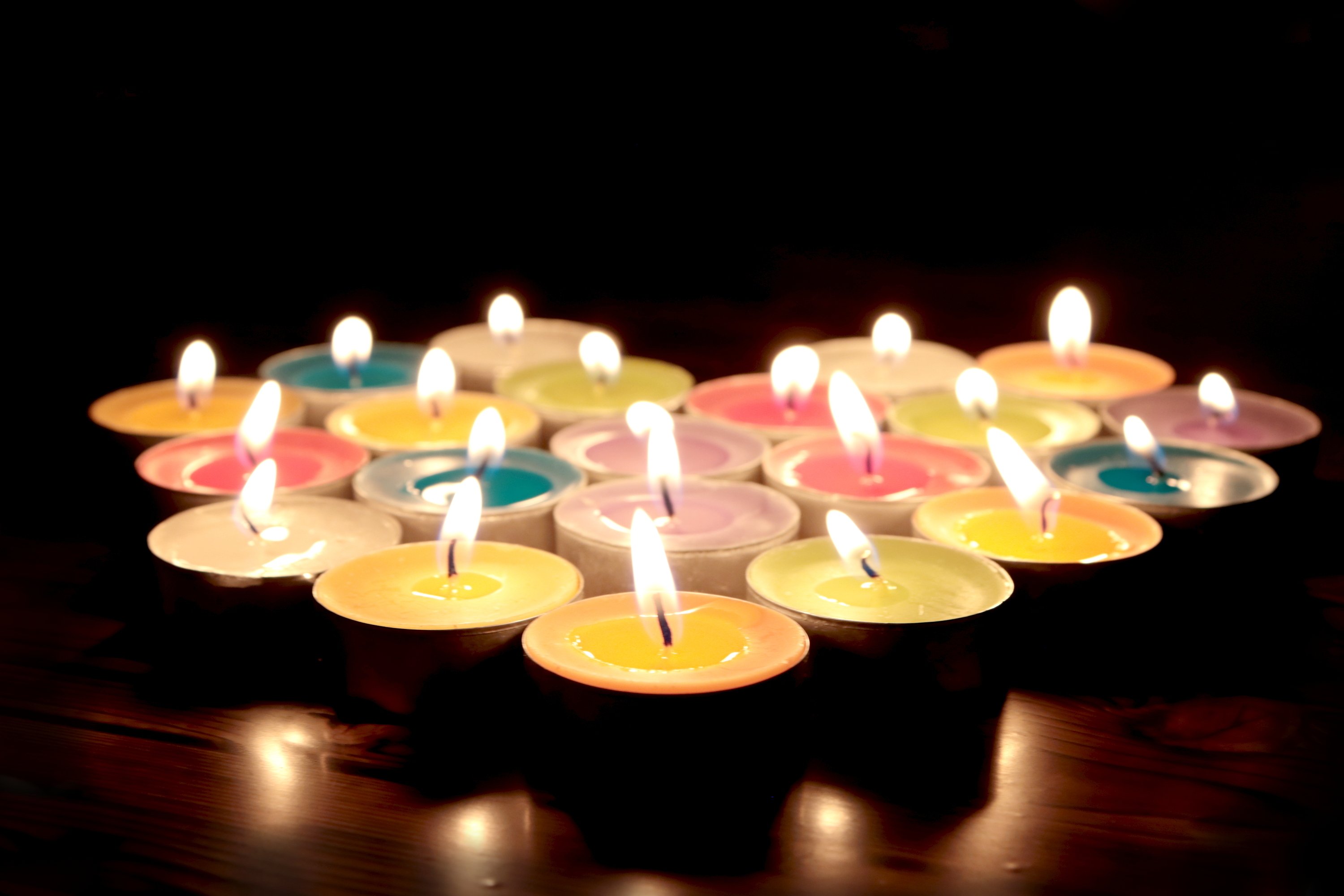 bigstock-Shining-Colorful-Candles-In-Ni-289418173